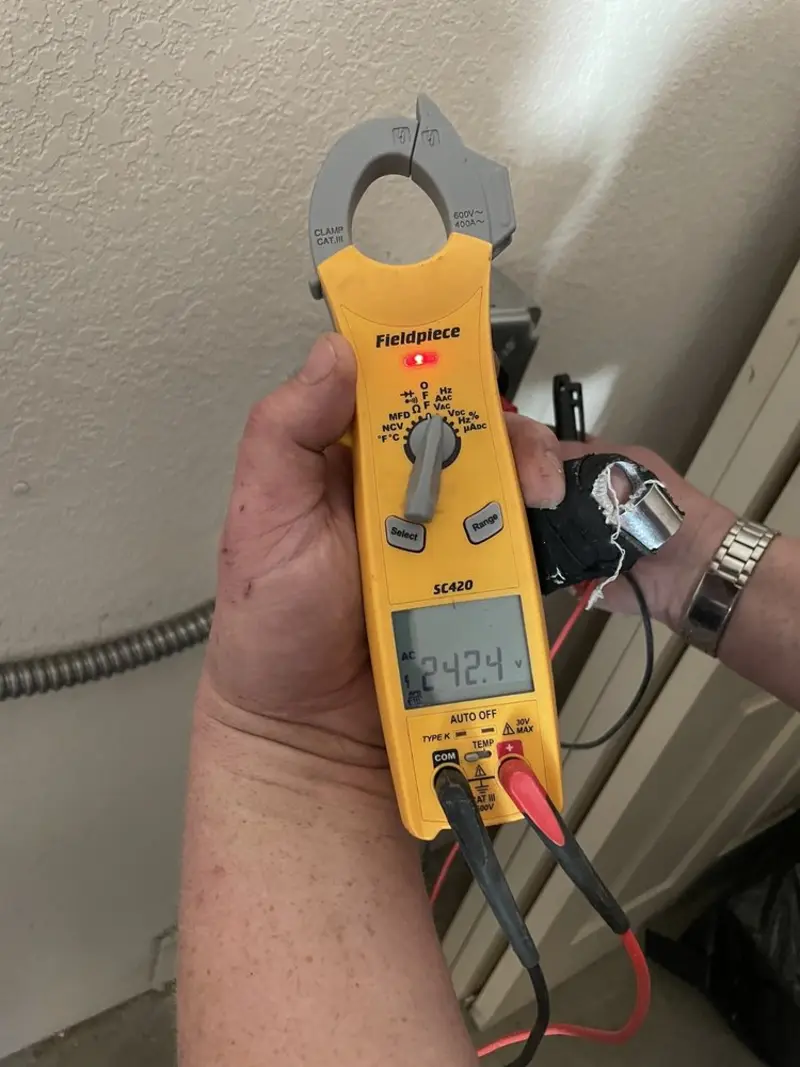 Voltage testing with clamp meter during Generator Installation in New Garden
